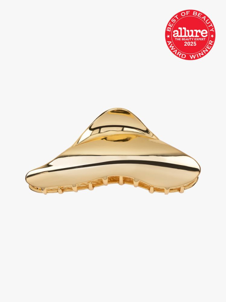 Jennifer Behr Amira Jaw Clip in gold color way on light gray background with red Allure Best of Beauty seal in the top right corner