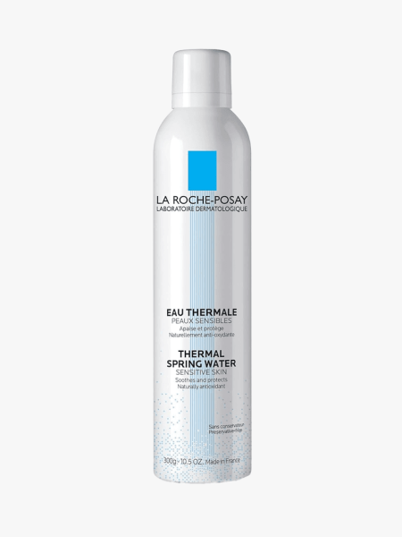 A white bottle of La Roche-Posay Thermal Spring Water on a light gray background