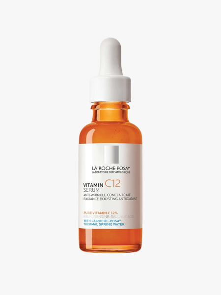 An orange and white dropper bottle of La Roche-Posay Pure Vitamin C12 Serum on a light gray background